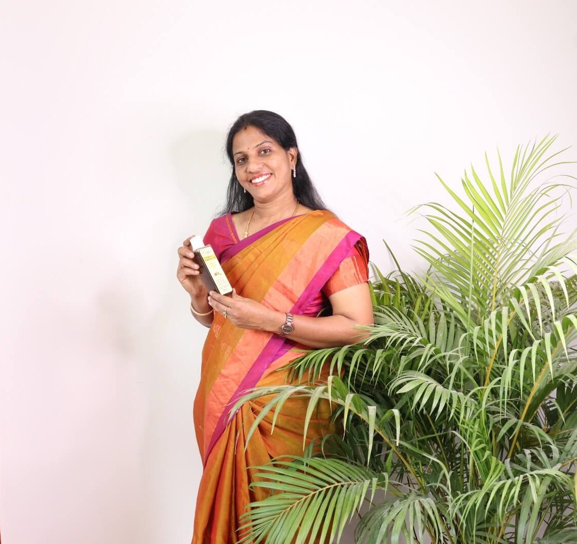Founder of Jos Organic holding a herbal product